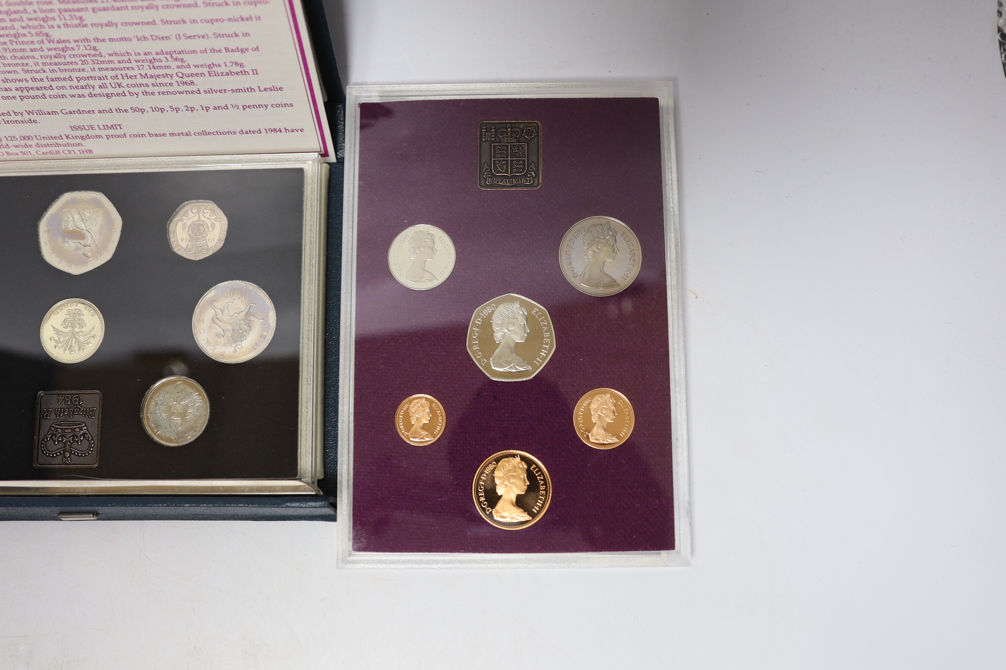 A National Service medal, various Royal Mint proof or BU coin sets etc.